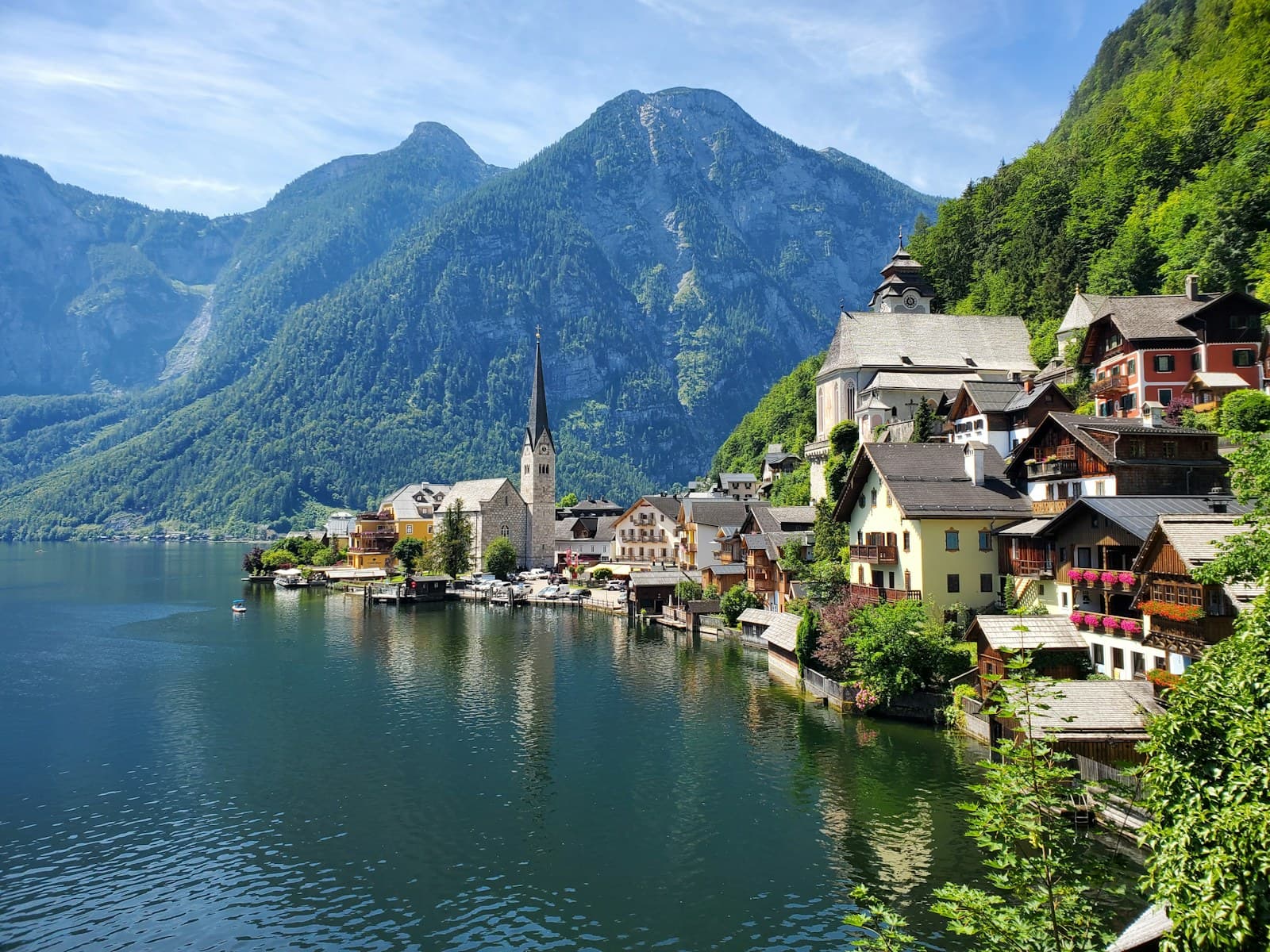 Austria: houses near body of water and mountain during daytime