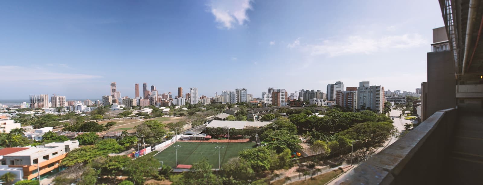 Barranquilla: a panoramic view of a city with a soccer field