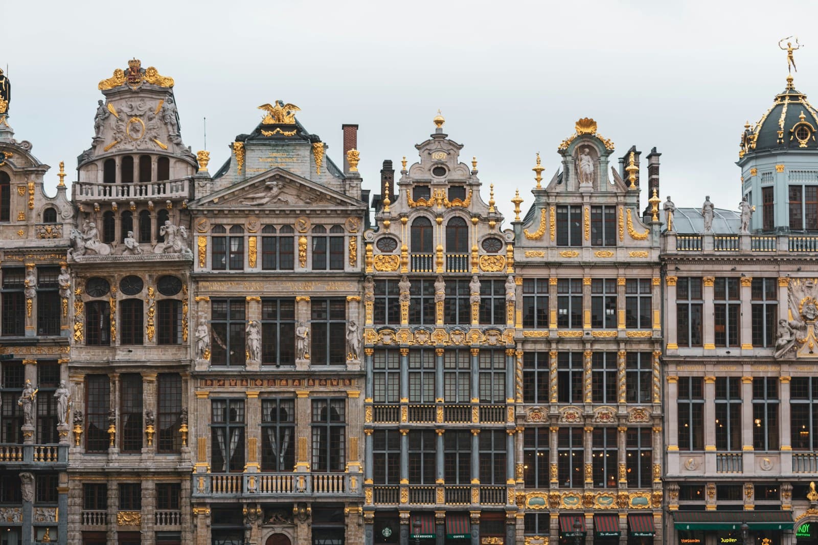 Brussels: brown and black concrete building under white sky during daytime