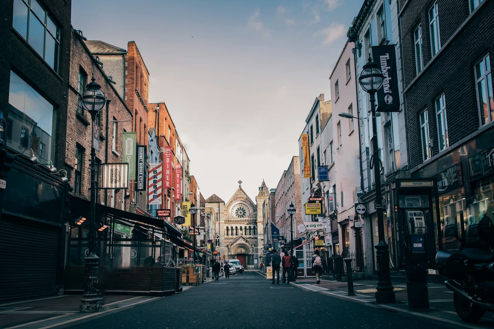 Dublin: people walking on street heading towards church
