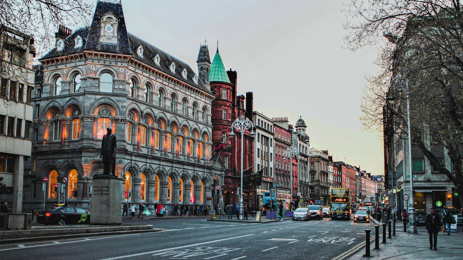 Dublin: a city street with a clock tower in the middle of it
