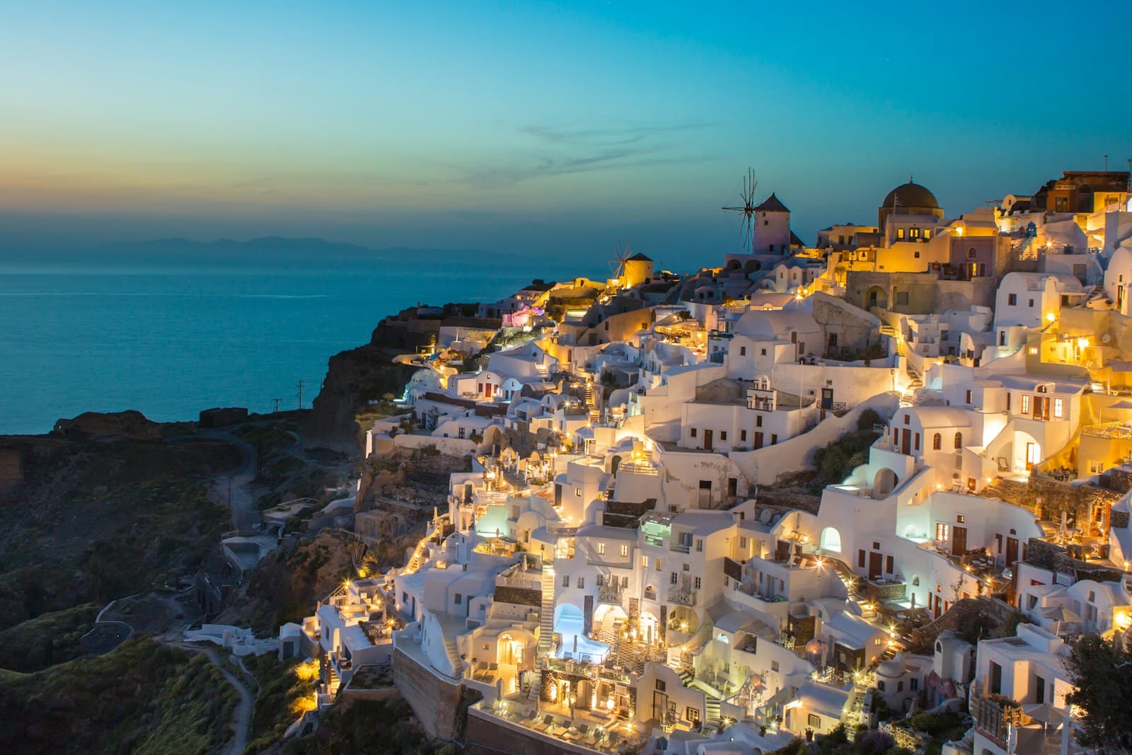 Greece: white and brown concrete houses on mountain near sea during daytime