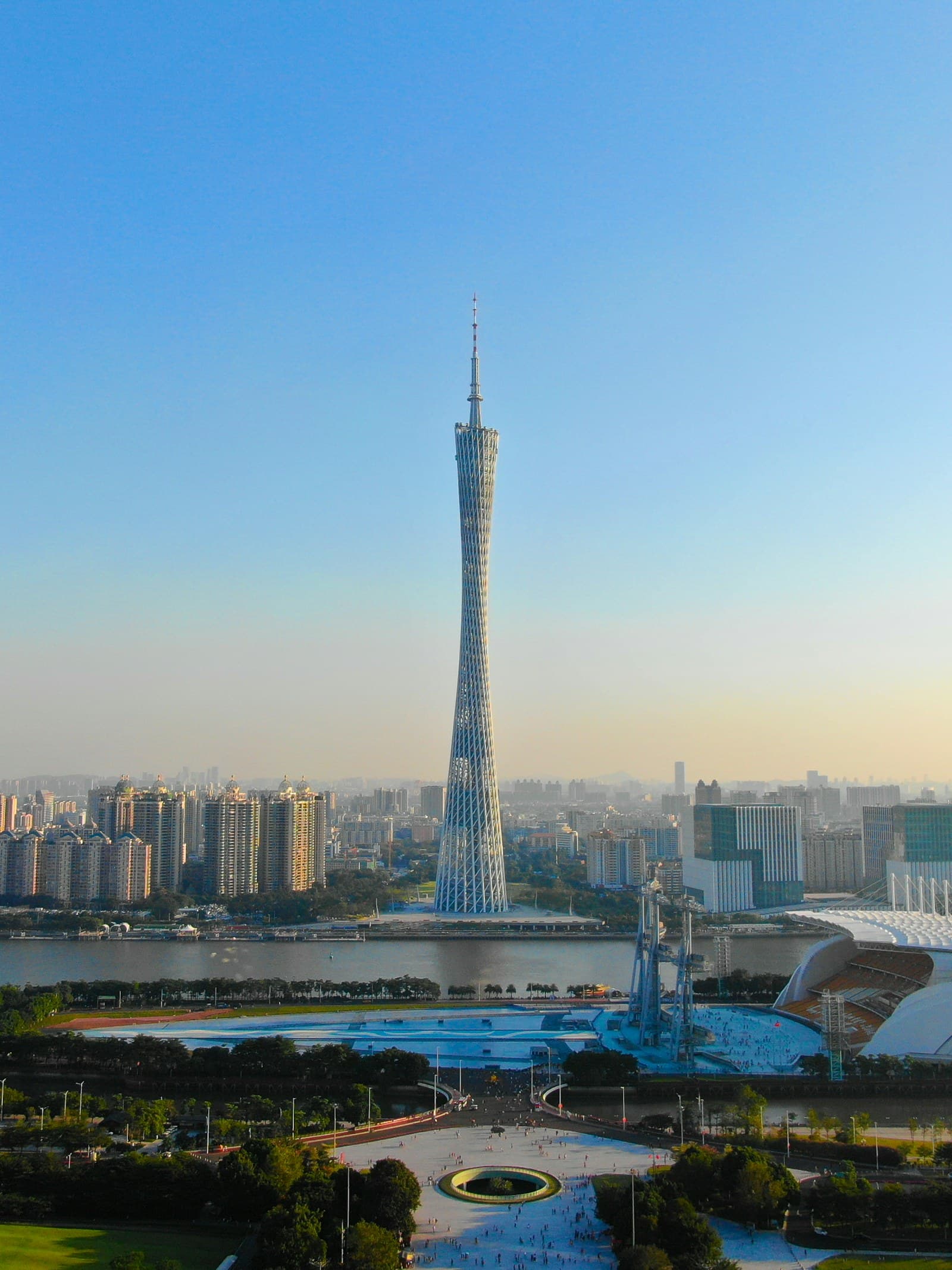 Guangzhou: gray high-rise building under clear blue sky