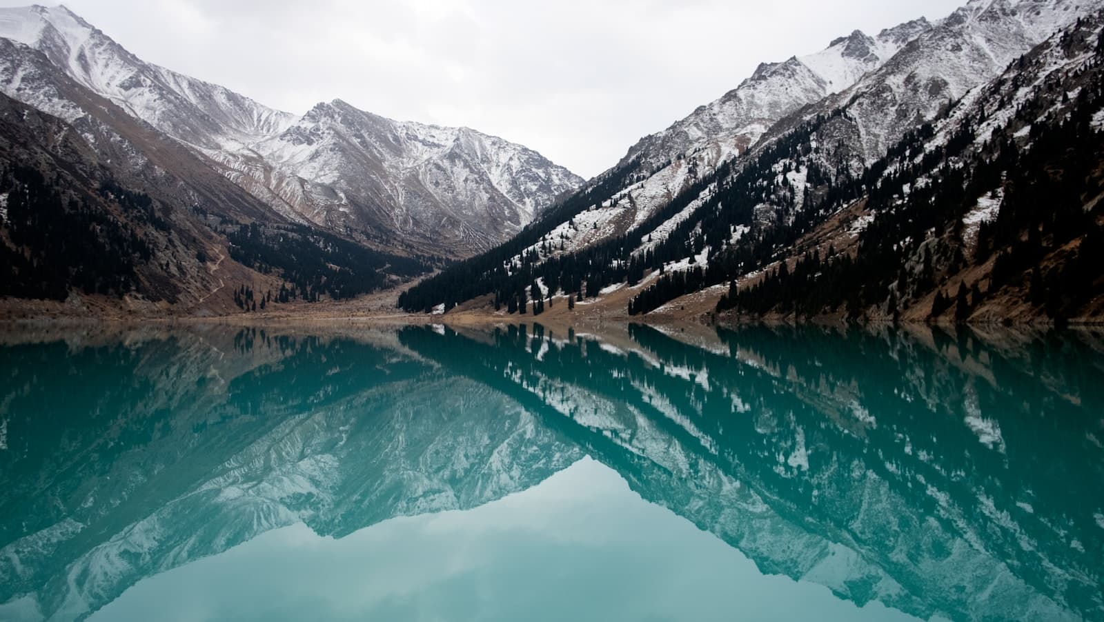 Kazakhstan: lake surrounded with mountains during daytime