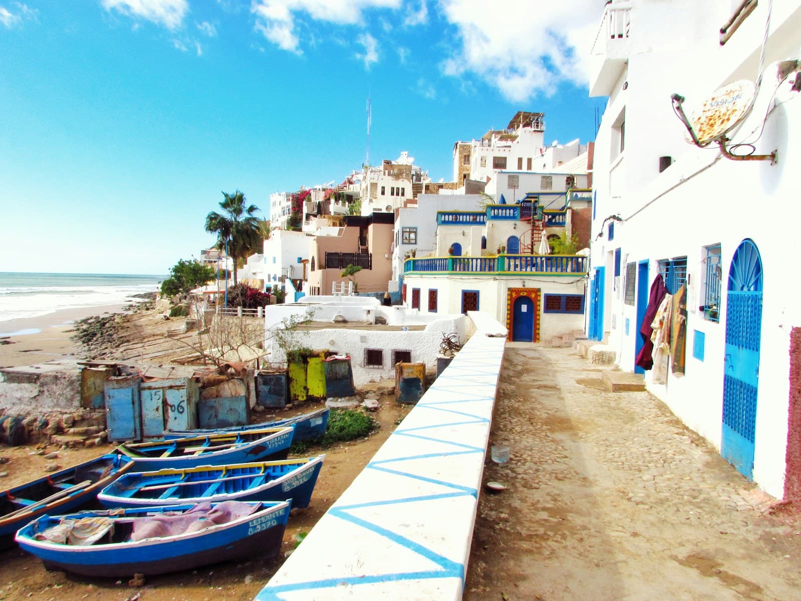 Morocco: boatd docked near houses and body of water