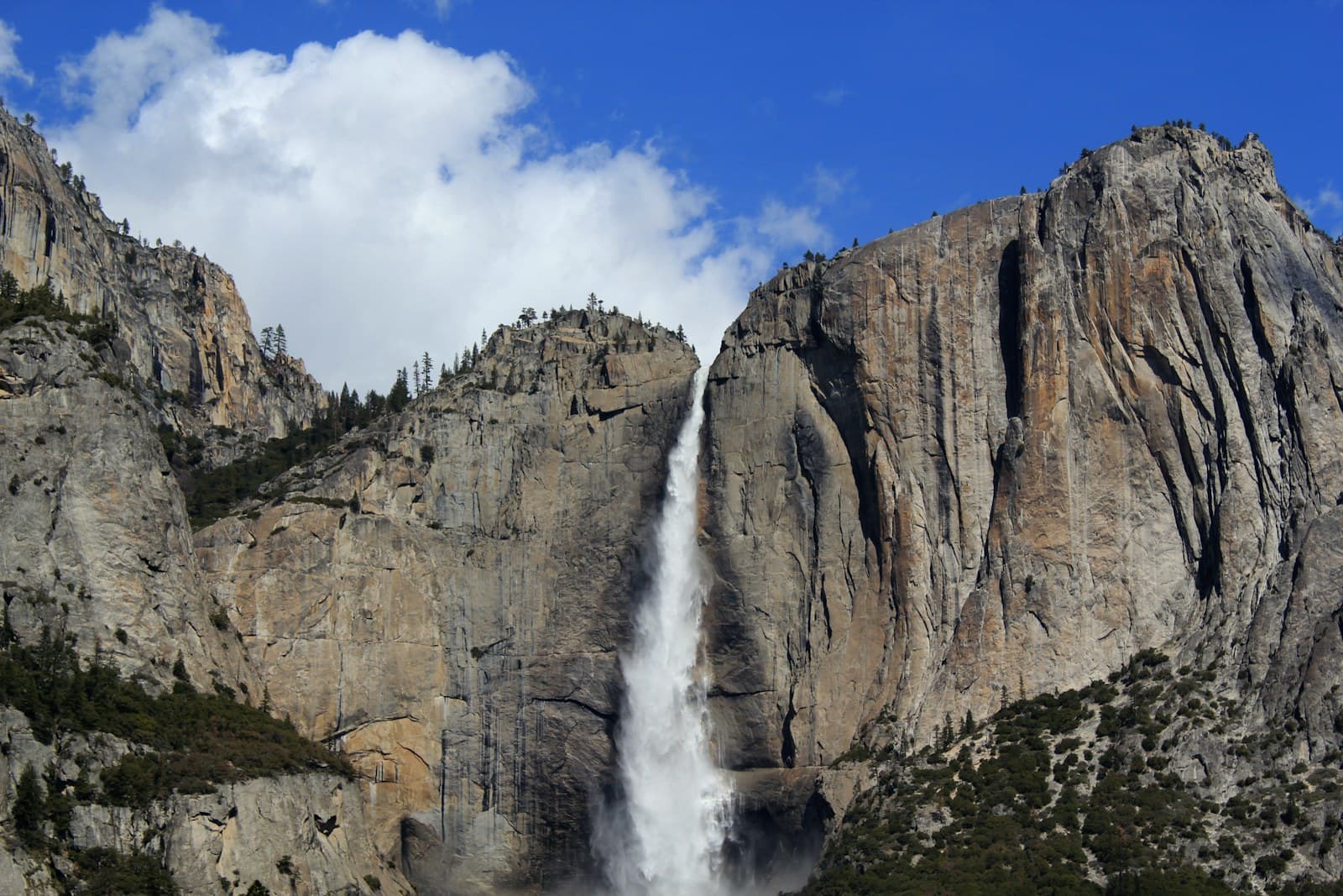 North America: waterfalls between gray stone mountain