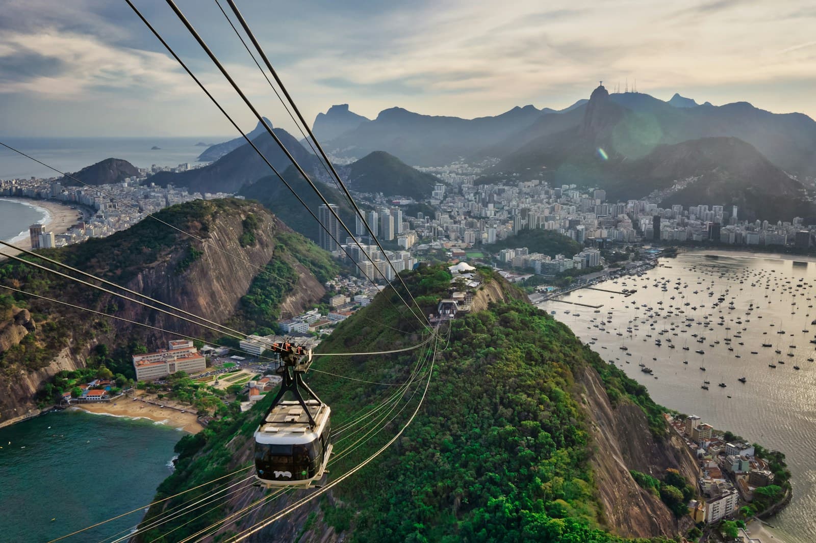 Rio de Janeiro: cable cars over the green grass field