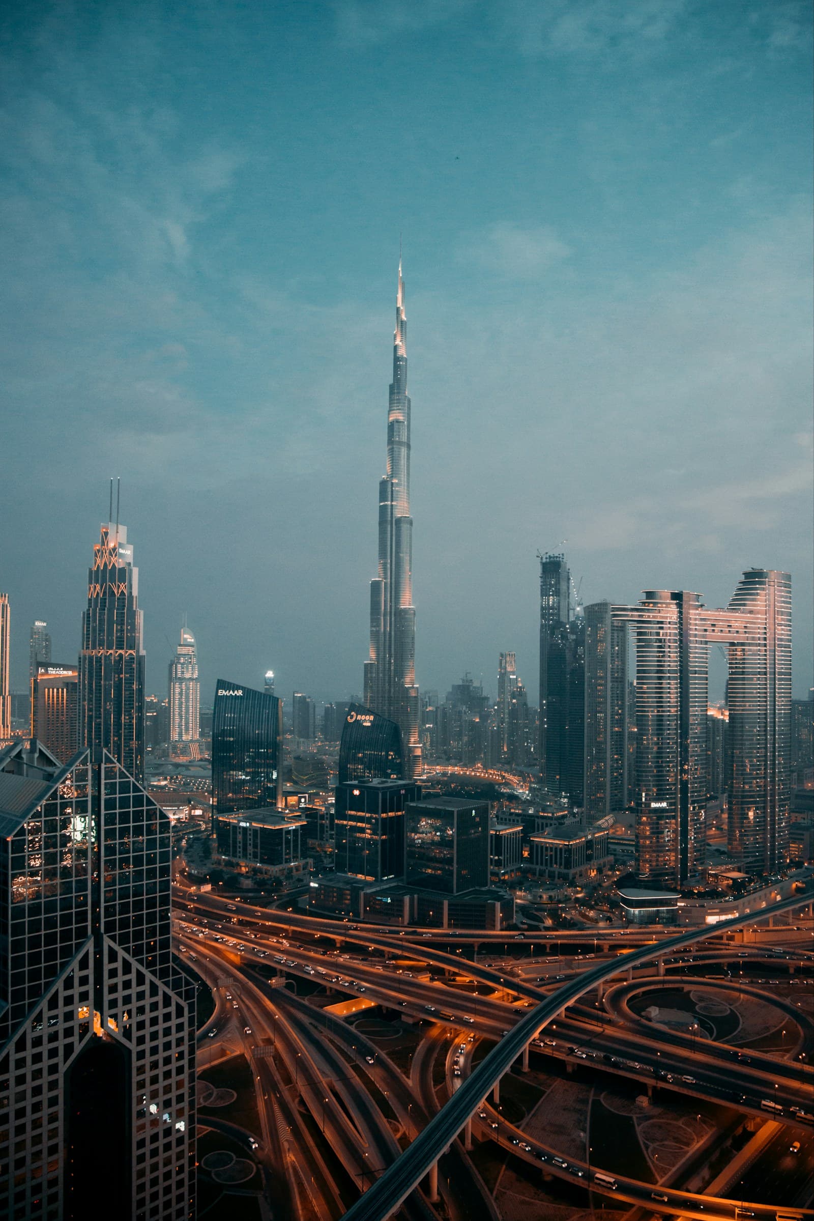 Dubai: a view of a city at night from the top of a skyscraper