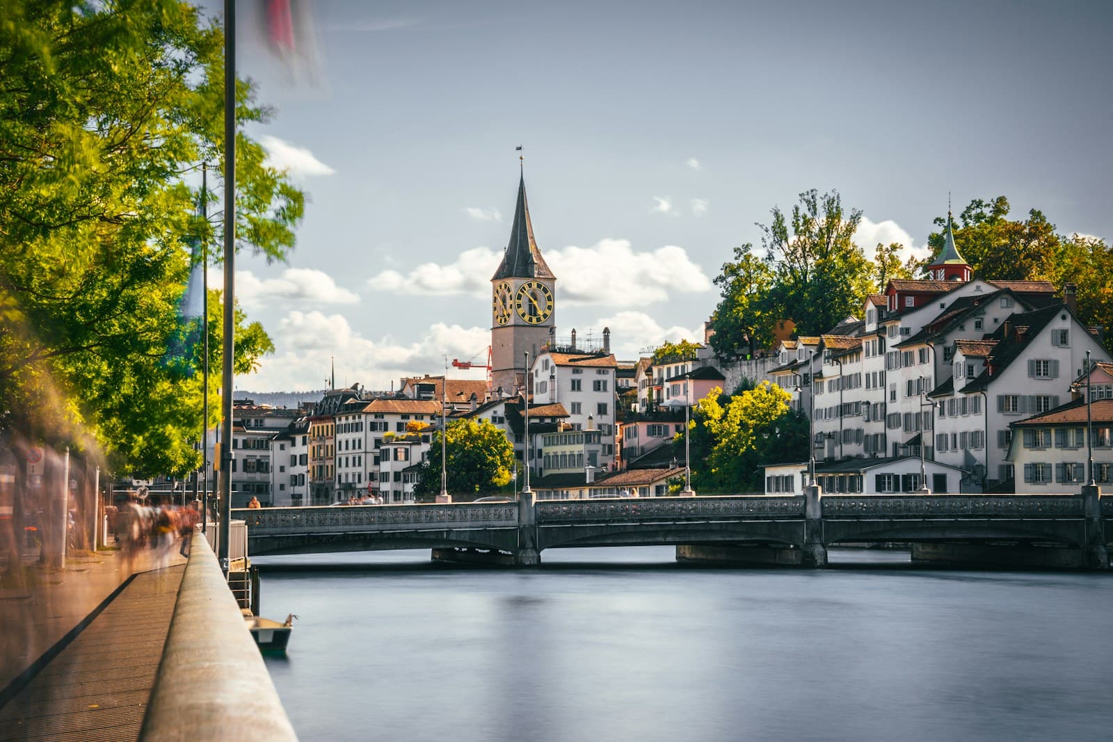 Zurich: a bridge over a river with buildings on either side of it