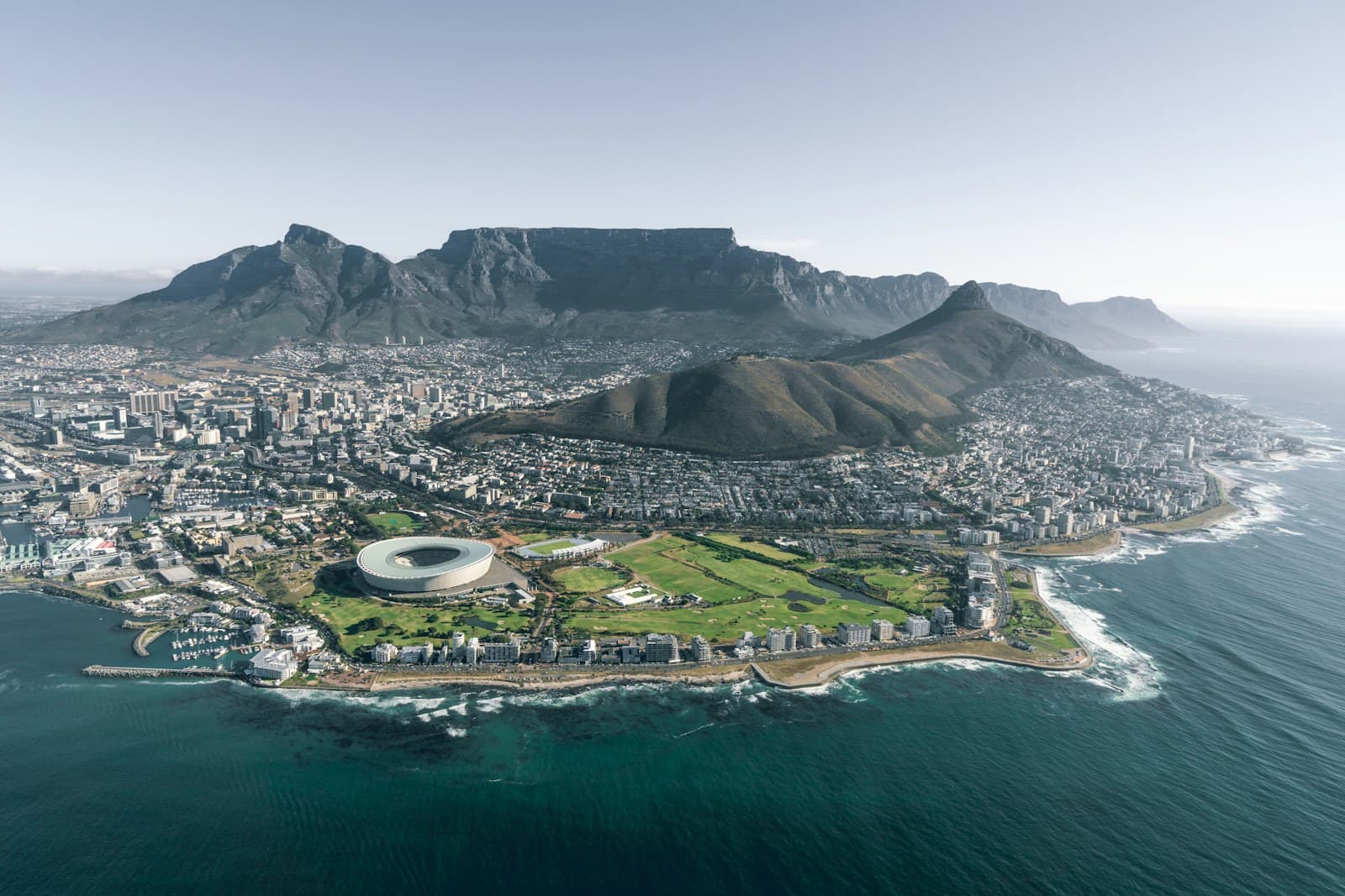 South Africa: aerial view of city near mountain during daytime